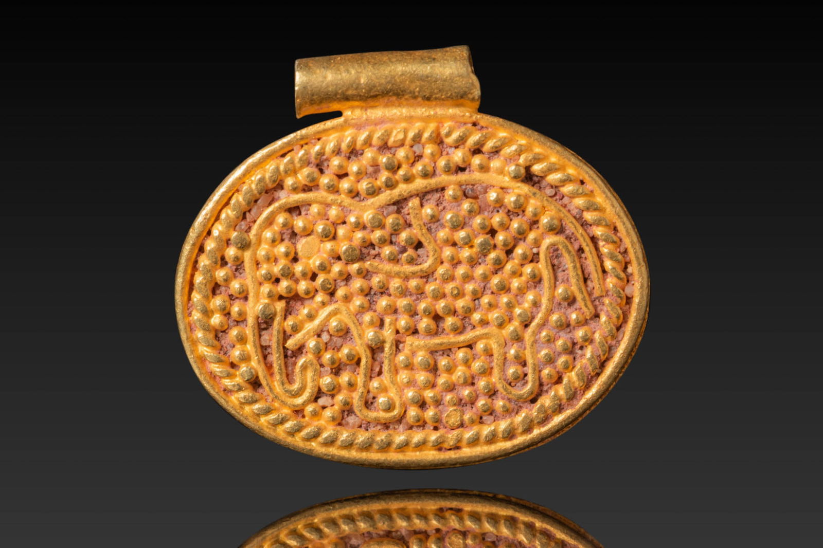 GRAECO-BACTRIAN HIGH KARAT GOLD PENDANT DEPICTING AN ELEPHANT (1 of 3)
