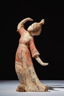 CHINESE TERRACOTTA DANCING LADY - TL TESTED: Tang Dynasty, Ca. AD 618 - 907. A terracotta dancing lady, dressed in a long skirt, with a mid-length overcoat, and hair arranged in a high double knot. Her upper body is slightly bent to the side, wi