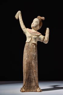 CHINESE TERRACOTTA DANCING LADY - TL TESTED: Tang Dynasty, Ca. AD 618 - 907. A terracotta dancing lady, dressed in a long dress with a long-sleeved cropped overcoat, mid-motion, with her arms held up, displaying the flowing garments. Size: L:300