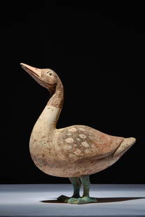 CHINESE TERRACOTTA GOOSE - TL TESTED: Han Dynasty, Ca. 202 BC - AD 220. A terracotta goose. The goose appears to be standing still, with its head held high, looking upwards, supported on bronze legs. The details are accentuated by red and