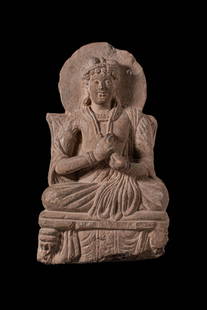 GANDHARAN STONE STATUE OF SEATED MATREIYA: Ca. AD 3-4th century or later. A stone figure of Matreiya. He is shown cross-legged in a meditative yet approachable pose, wearing monastic robes with rhythmic, cascading folds rendered in deep relief