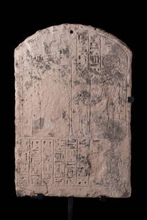 EGYPTIAN SANDSTONE VOTIVE STELA OF THE PRIEST DJEHUTYMOSE DEDICATED TO PTAH AND SEKHMET: Third Intermediate Period, XXII Dynasty Ca. 1068-525 BC . A rectangular sandstone stele with a domed top, finely carved. The composition presents the lion-headed goddess Sekhmet standing in profile to