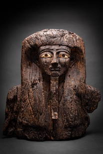 LARGE EGYPTIAN WOODEN SARCOPHAGUS MASK: Late Period, Ca. 664 - 332 BC. A broad carved wooden sarcophagus mask depicting a stylised male face with a tripartite wig extending over the shoulders and a long false beard. The face is defined by a