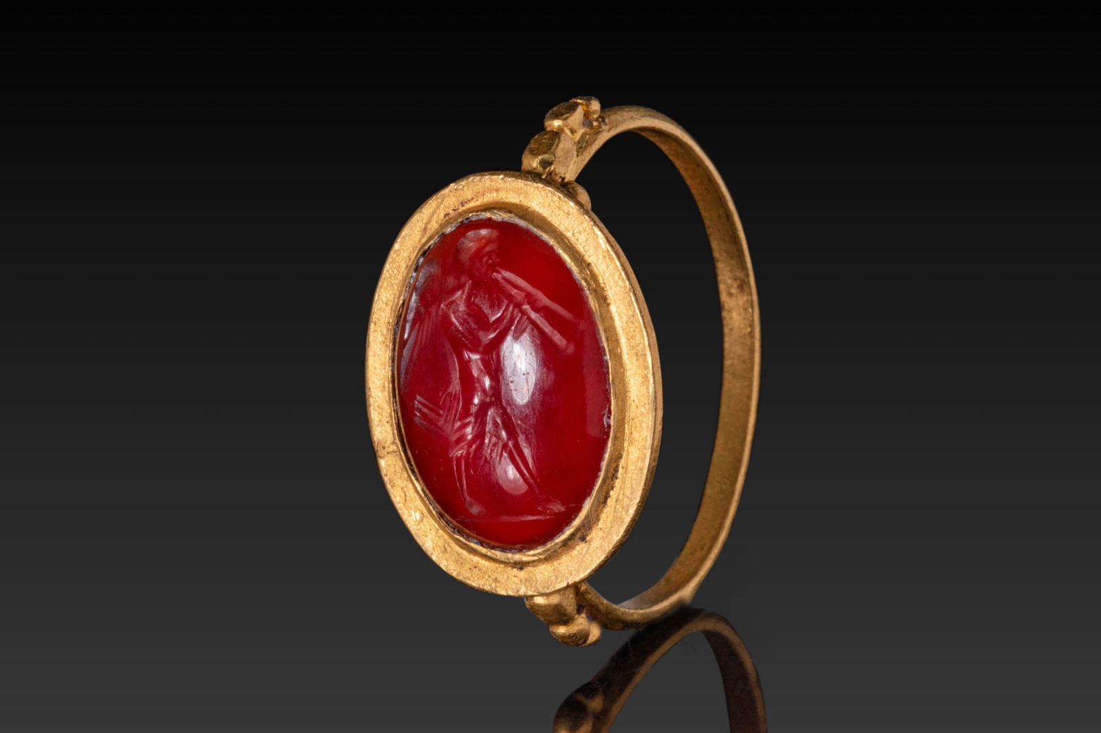 ROMAN HIGH KARAT GOLD RING WITH INTAGLIO DEPICTING PAN PLAYING DOUBLE FLUTE (1 of 3)