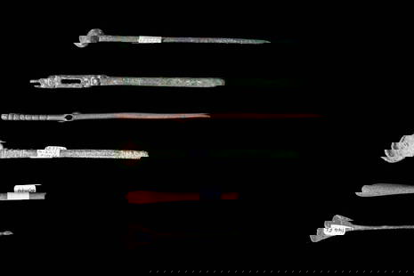 COLLECTION OF ROMAN BRONZE SURGICAL TOOLS: Ca. AD 1 - 300. A collection of six surgical implements in bronze and wood. The first one on the top is a long bronze pin with a rounded terminal knob and a pointed tip. The second is a bronze tool wi