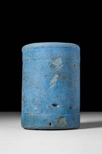 EGYPTIAN BLUE TUBULAR VASE: Third Intermediate Period, Ca. 943 - 716 BC. An Egyptian blue cylindrical vase with a flat base and upright sides, defined by horizontal bands at the top and bottom.Size: 80mm x 60mm; Weight: 350gProv