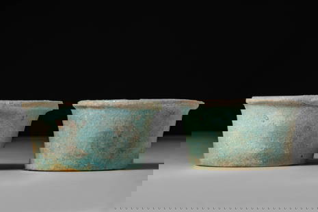 PAIR OF EGYPTIAN FAIENCE OFFERING CUPS: 30th Dynasty, Ca. 380 - 343 BC. A pair of pale green faience offering cups, each with a slightly flaring, cylindrical body finished with a pronounced rim.For similar see: MET museum Object Number: 26.