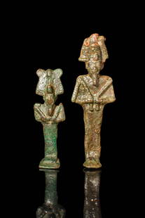 PAIR OF EGYPTIAN BRONZE FIGURINES OF OSIRIS: Late Period, Ca. 664 - 332 BC. A pair of standing bronze figures depicting Osiris, each shown mummiform with arms crossed over the chest, holding the crook and flail. Both figures wear the atef crown