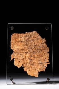 GREEK ERA PAPYRUS WITH INSCRIPTION: Ca. 664 - 332 BC. A fragment of papyrus inscribed with text in black ink, written in horizontal lines across the surface. Mounted within a modern frame.For similar see: The Metropolitan Museum of Art,