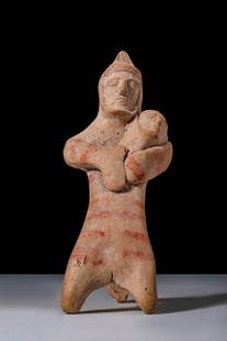 EASTERN GREEK TERRACOTTA FUNERARY TRIPODE FIGURINE DEPICTING A MAN HOLDING A BABY: Ca. 600 - 500 BC. A terracotta anthropomorphic figurine with an elongated lower body dividing into two forward-projecting legs and a third leg extending backward. The upper body is broad, with thick a