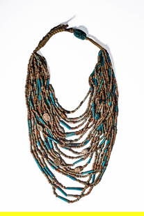 EGYPTIAN FAIENCE NECKLACE WITH SCARABS: Ca. 1550 - 30 BC. A multi-strand restrung necklace composed of tubular and ring-shaped faience beads in blue, green, and beige tones. Interspersed among the strands are several scarabs, mostly steatit
