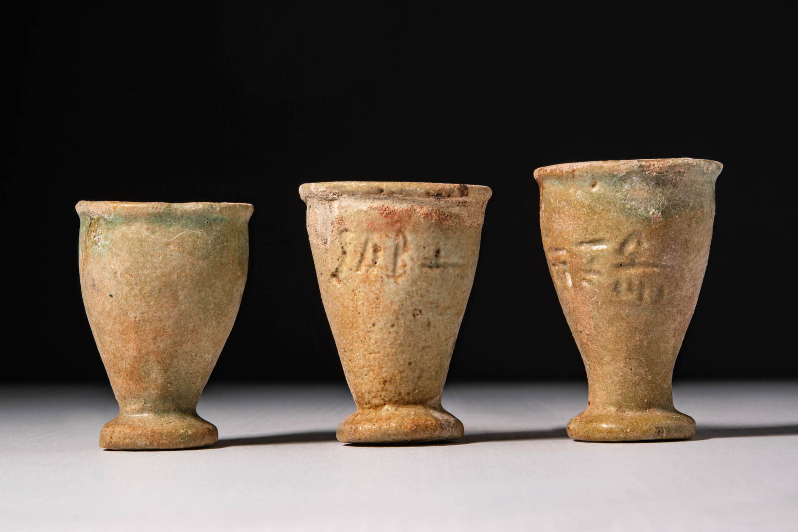 COLLECTION OF THREE EGYPTIAN FAIENCE CUPS (1 of 3)