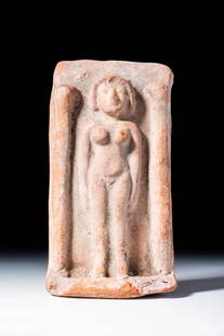 PHOENICIAN TERRACOTTA PLAQUE WITH TANIT: Ca. 600 - 400 BC. A rectangular terracotta plaque with a recessed central field bordered by two rounded columns. Within the niche stands a stylised nude female figure with simplified facial features,
