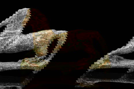 ROMAN BRONZE APPLIQUE WITH GALLOPING HORSE: Ca. AD 200. A bronze appliqu&#233; depicting a horse in mid-gallop, positioned on an integral rectangular base. Legs are shown in dynamic extension, and the long, arched tail curves back towards the b