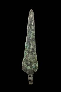 BRONZE AGE EUROPEAN BRONZE SPEARHEAD: Ca. 1000 - 800 BC. A cast bronze spearhead with a triangular blade. The tang is pierced by two vertically aligned rivet holes. For similar see: Christie's, Live Auction 5524, Axel Guttmann collection