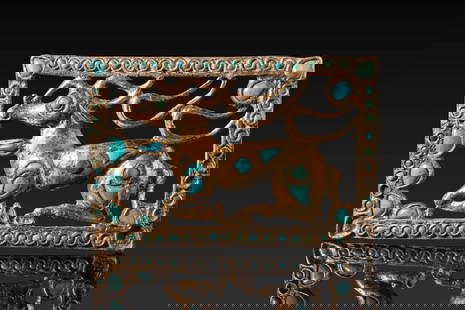 STUNNING SCYTHIAN GOLD AND TURQUOISE BELT FITTING DEPICTING STAG IN FRAME: Ca. 400 - 100 BC. A gold belt fitting cast as a rectangular openwork frame enclosing a recumbent stag with branching antlers. The body is decorated with turquoise inlays, including circular and