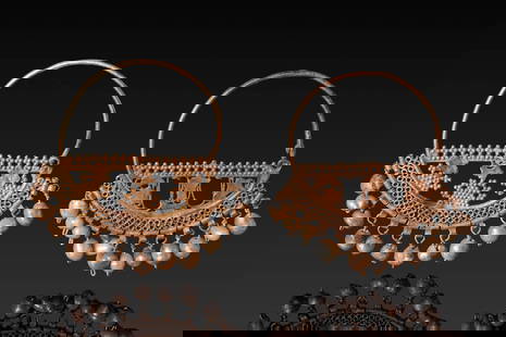 PAIR OF BYZANTINE OPENWORK HIGH KARAT GOLD EARRINGS WITH PEARLS: Ca. AD 500 - 600. A matched pair of gold earrings, each formed from a circular hoop supporting a crescent-shaped openwork panel decorated with intricate filigree and bordered along the lower edge