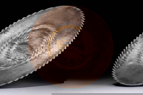 SASANIAN SILVER-GILT SHALLOW BOWL WITH PHEASANT: Ca. AD 400 - 600. A shallow silver bowl with gently curving walls and a central decorative medallion depicting a gold repoussé pheasant shown in left profile, with finely incised plumage and a long