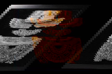 EGYPTIAN CARTONNAGE WITH CENTRAL FUNERARY COLLAR: Late Period to ptolemaic Period, Ca. 664 - 30 BC. A group of painted cartonnage fragments. At the top is a fragment depicting the sky goddess Nut, shown in profile with a solar disc above her head