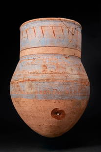 EGYPTIAN BLUE-PAINTED TERRACOTTA JAR WITH LOTUS PETALS: Amarna Period, Ca. 1353 - 1336 BC. A blue-painted pottery jar with an ovoid body rising to a broad shoulder, a tall cylindrical neck and a pronounced rim. The decoration, painted in blue with red and