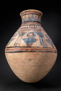 EGYPTIAN BLUE-PAINTED TERRACOTTA JAR WITH NILOTIC PLANTS: Amarna Period, Ca. 1353 - 1336 BC. A blue-painted terracotta jar of biconical profile with the shoulder set below a slender neck and a flaring everted rim with a rounded lip. Painted in black, red