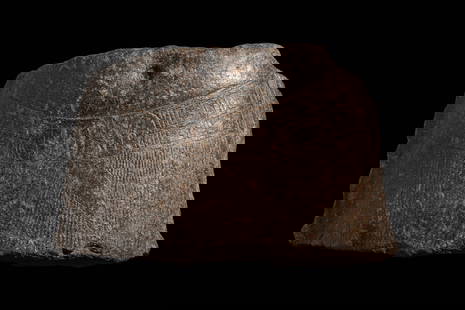 COLOSSAL EGYPTIAN BLACK STONE FRAGMENT OF STATUE OF THE PHARAOH RAMESSES II: New Kingdom, XIX Dynasty regin of Ramesses II Ca. 1379- 1212 BC. A large fragment from the lower torso of an over-lifesize statue, carved in dark hardstone. It preserves the convex abdomen with a