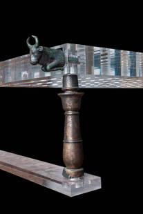 RARE ROMANO-EGYPTIAN BED WITH BRONZE FITTINGS: Ca. 30 BC - AD 200. A set of bronze bed fittings: the four tapering legs with moulded collars, each surmounted by a bull's head projecting from the corner. Five double-sided bronze Hathor heads top