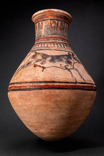 EGYPTIAN BLUE-PAINTED TERRACOTTA JAR WITH BULLS: Amarna Period, Ca. 1353 - 1336 BC. A blue-painted terracotta jar of biconical form with a broad shoulder and a tall neck finished with a wide everted rim and rounded lip. Decoration in black, red and