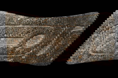 EGYPTIAN GRANITE CRAMP OF SETI I: Ca. 1294 - 1279 BC. A butterfly-shaped granite cramp incised with hieroglyphs reading "the good god Menmaatre", the throne name (prenomen) of Pharaoh Seti I. Such cramps were employed in the