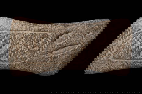 EGYPTIAN DOVETAIL STONE BLOCK WITH CARTOUCHE OF THE PHARAOH MERENPTAH: New Kingdom, XIXth Dynasty, regin of Sethi I Ca 1291-1278 BC. A butterfly-shaped granite cramp incised with the throne name (prenomen) of Pharaoh Seti I. Such cramps were employed in the construction