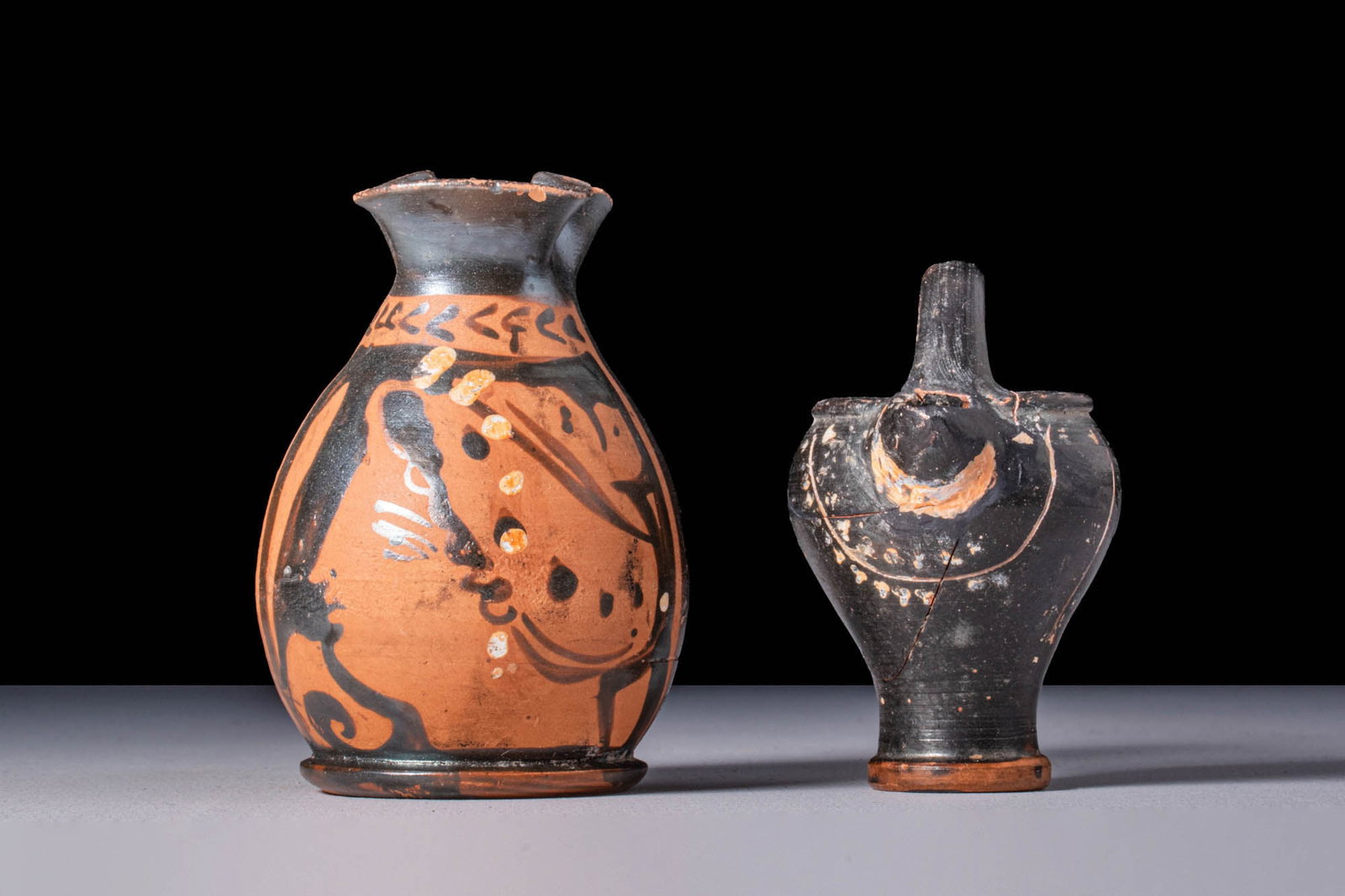 PAIR OF APULIAN TERRACOTTA BLACK-GLAZED VESSELS (1 of 4)