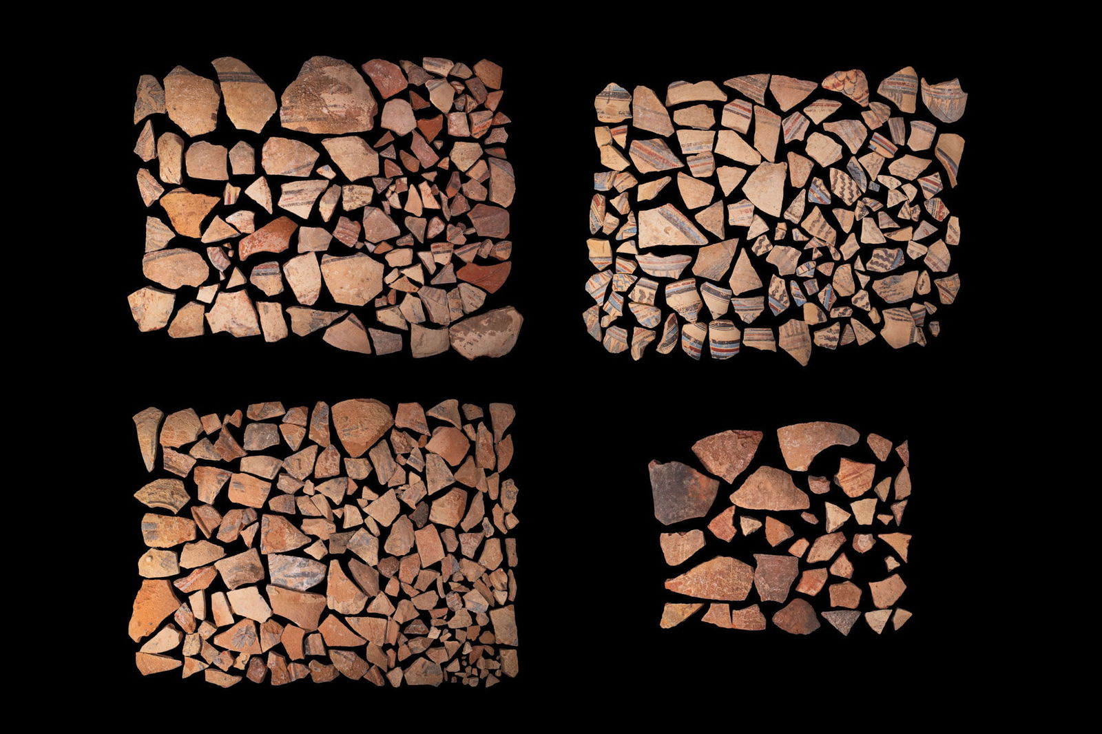 COLLECTION OF AMARNA VESSEL SHERDS: Amarna Period, Ca. 1353 - 1335 BC. A collection of polychrome pottery sherds, with neck, shoulder and body fragments, the exterior painted in red, blue and black on a buff ground with horizontal bandi