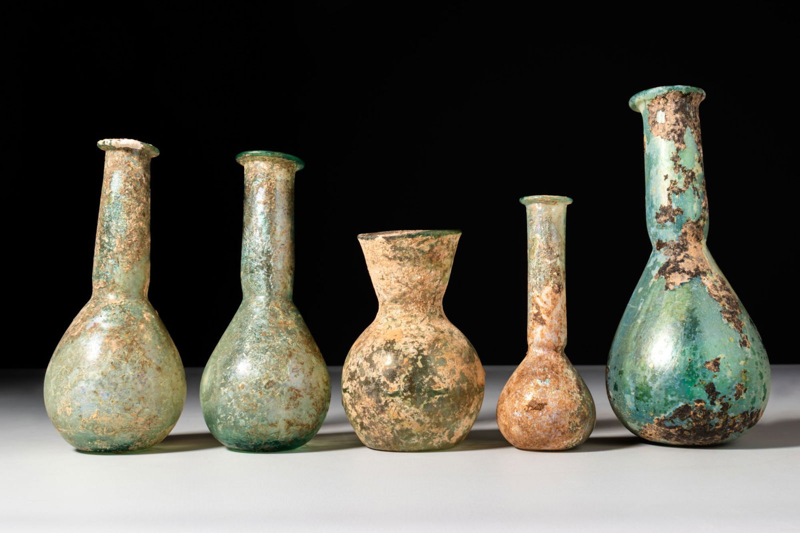 COLLECTION OF ROMAN GLASS UNGUENTARIA (1 of 4)