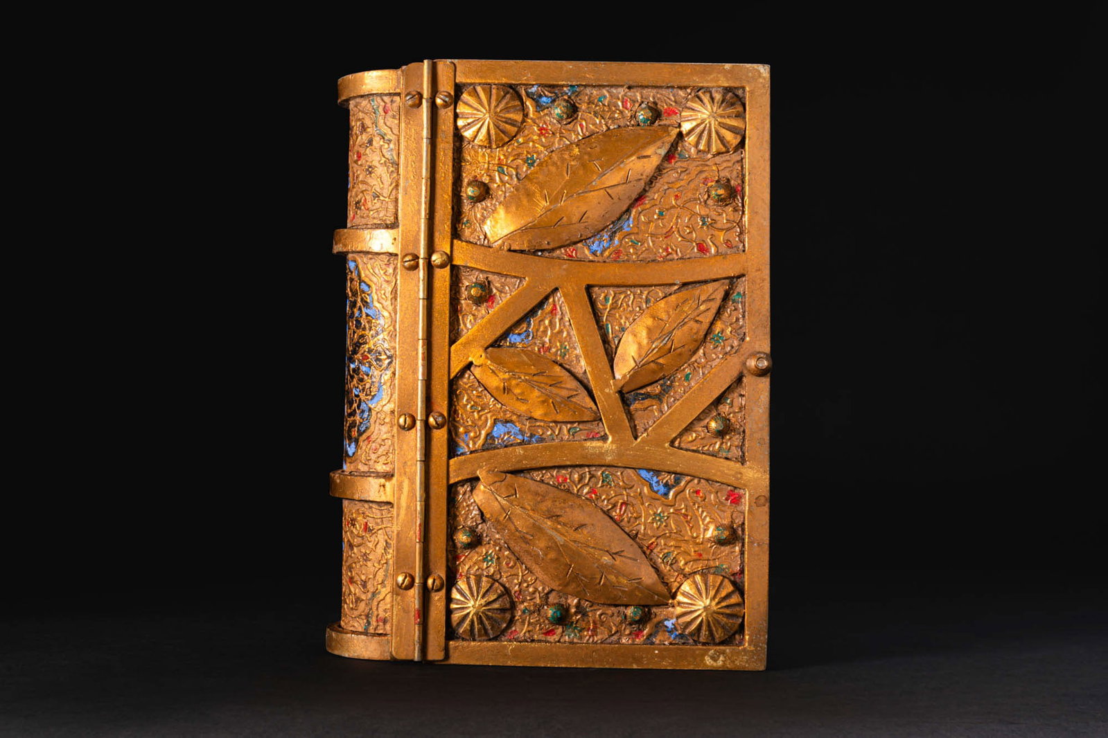 OTTOMAN MUSHAF MUHAFAZA: Probably Istanbul Ca. late 19th - early 20th century AD. A manuscript cover formed as a rectangular case with a semi-cylindrical spine. The front is decorated with four lanceolate leaves within plain 