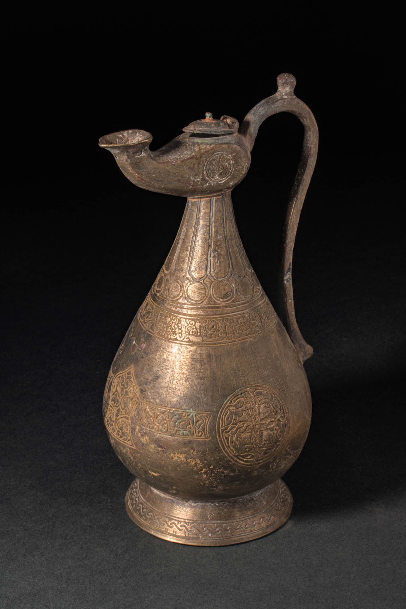 A SELJUK BRONZE EWER WITH LAMP-SHAPED SPOUT (1 of 8)