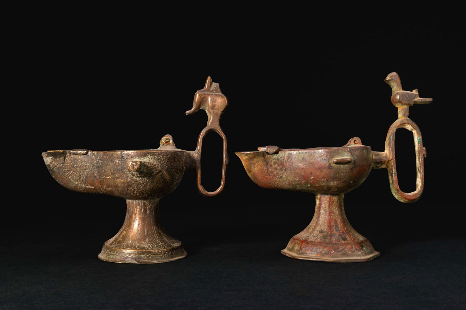 PAIR OF SELJUK BRONZE OIL LAMPS WITH ZOOMORPHIC FINIALS (1 of 6)