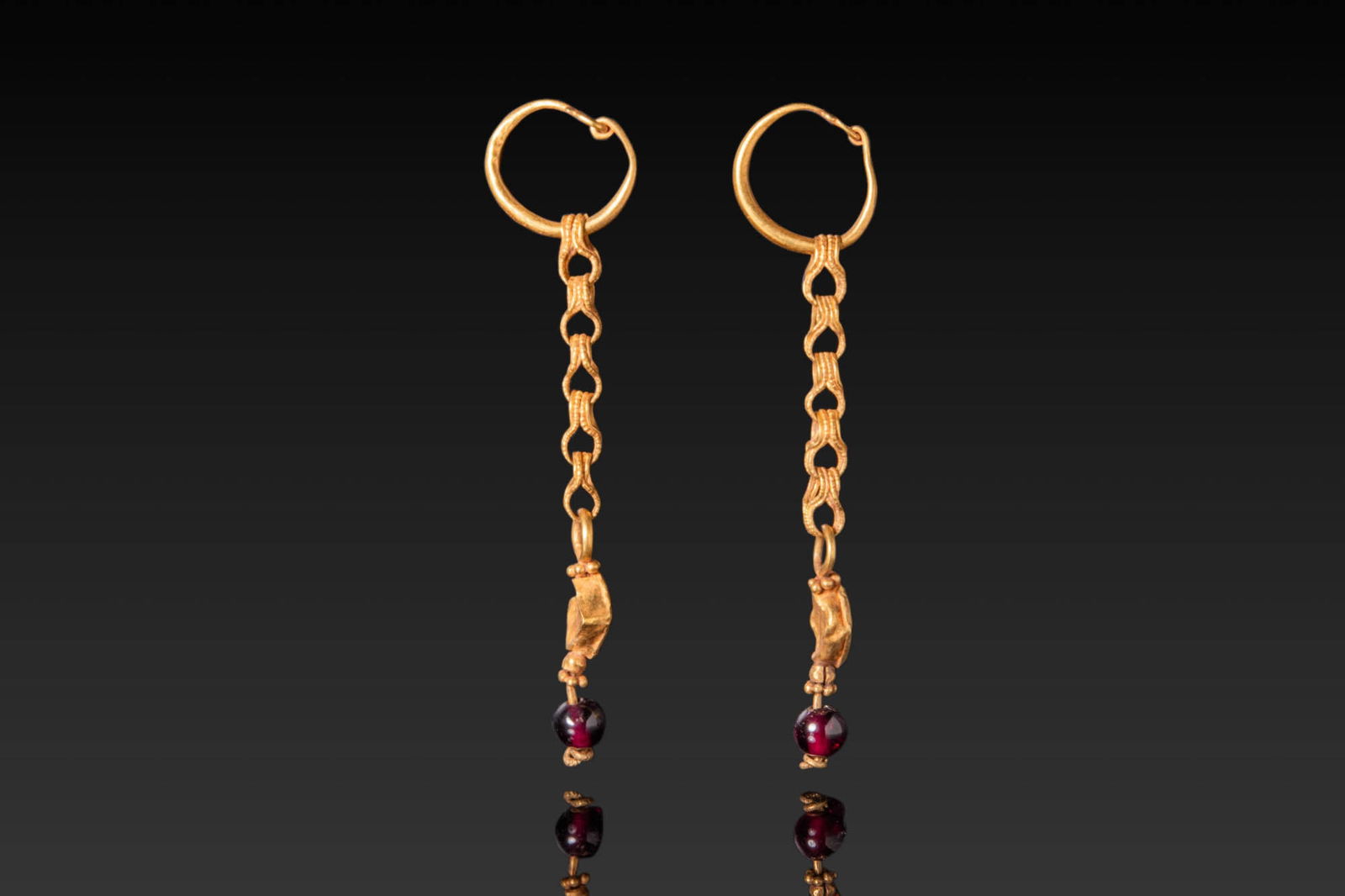 PAIR OF BYZANTINE HIGH KARAT GOLD EARRINGS WITH RED GARNET CABOCHONS (1 of 3)