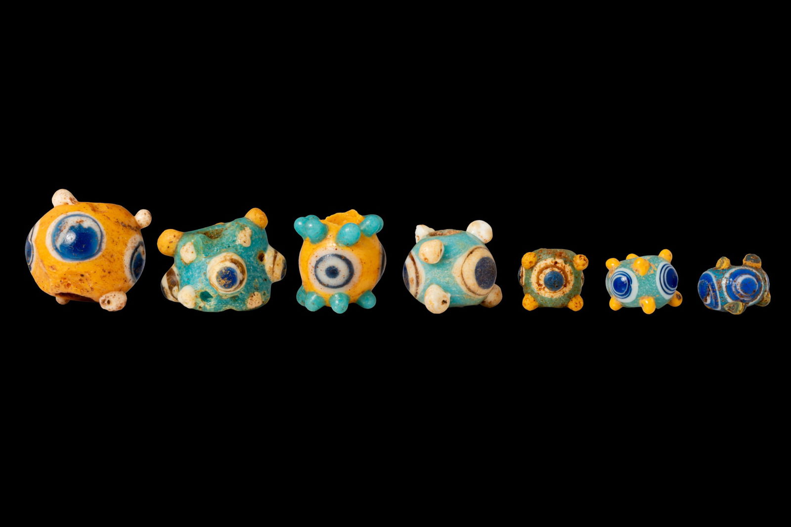COLLECTION OF PHOENICIAN EYE GLASS BEADS (1 of 4)