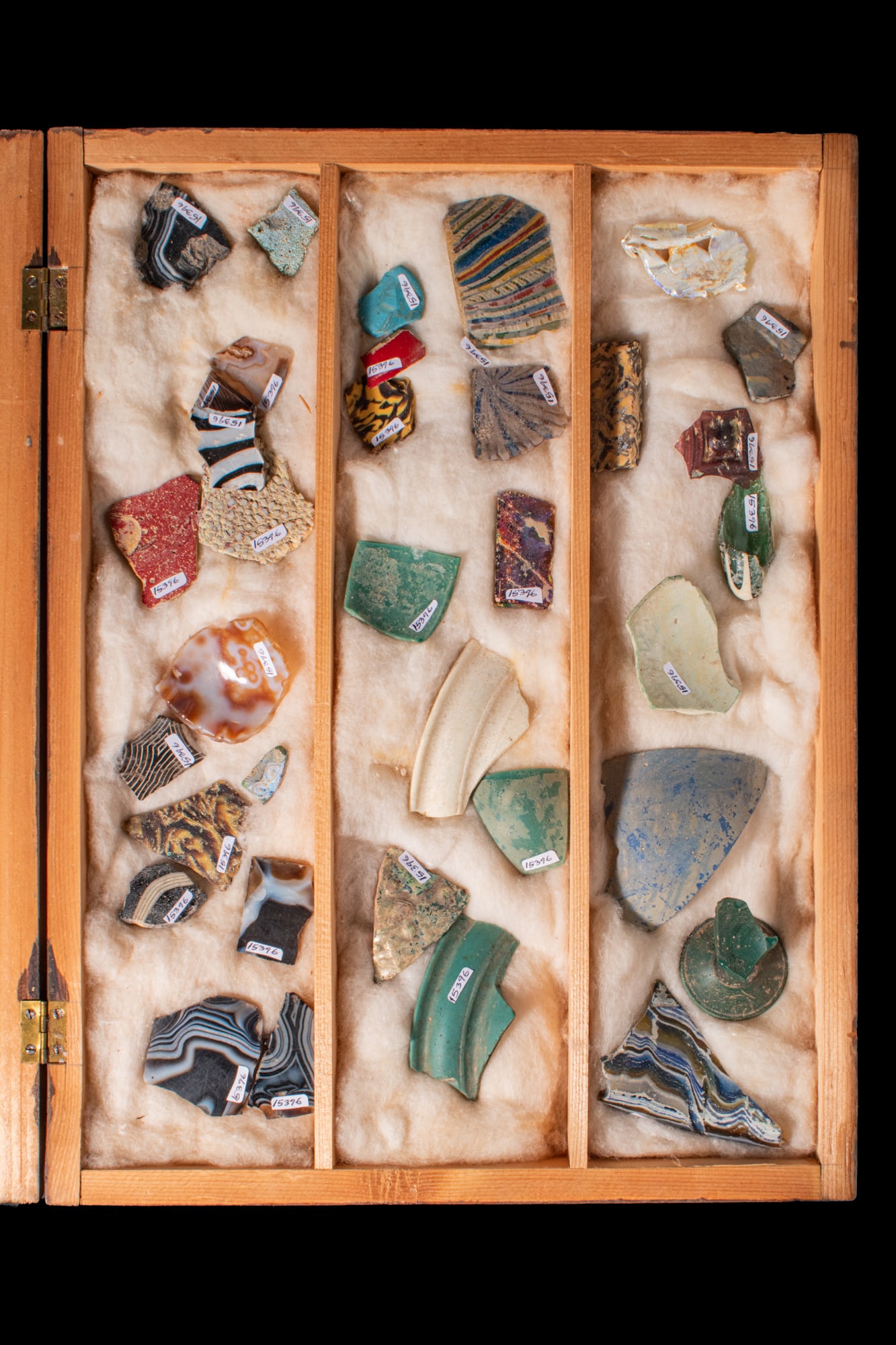 LARGE COLLECTION OF ROMAN POLYCHROME GLASS INLAYS AND SECTILIA: Ca. 100 BC - AD 100A collection of polychrome glass inlays and sectilia fragments, including assorted small inlay fragments; mosaic, marbled and banded glass pieces in varied colours; and larger secti