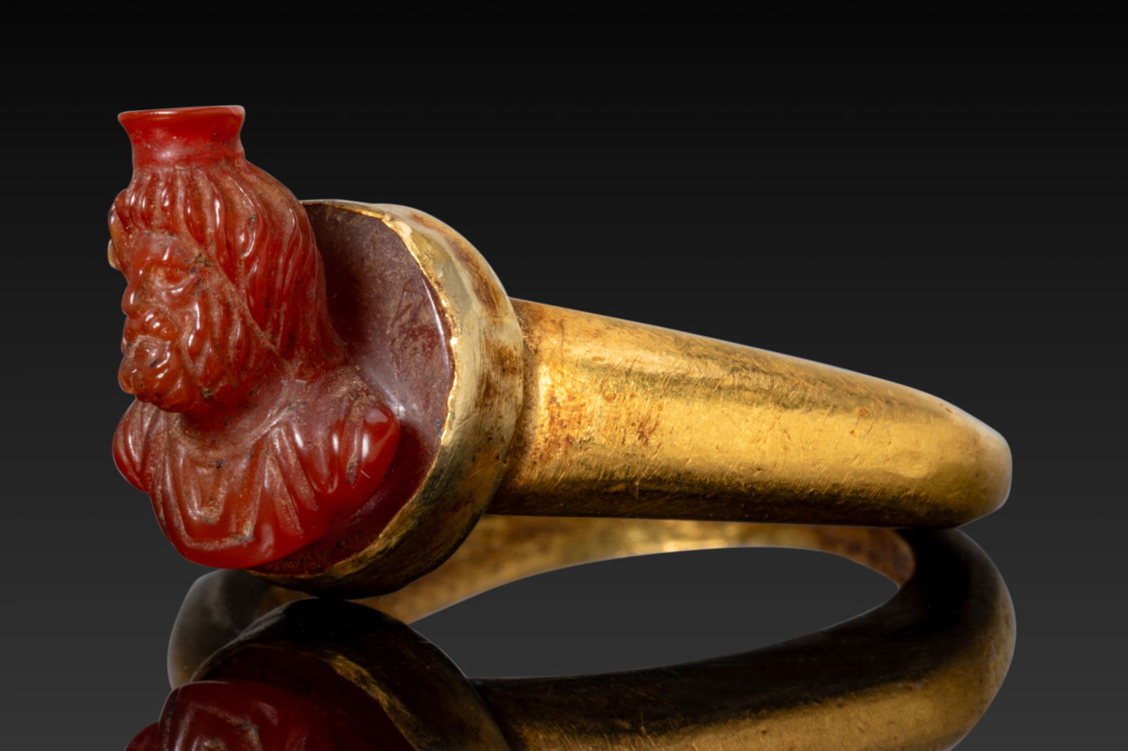 ANCIENT ROMAN HIGH KARAT GOLD RING WITH CARNELIAN BUST OF SERAPIS IN HIGH RELIEF (1 of 3)