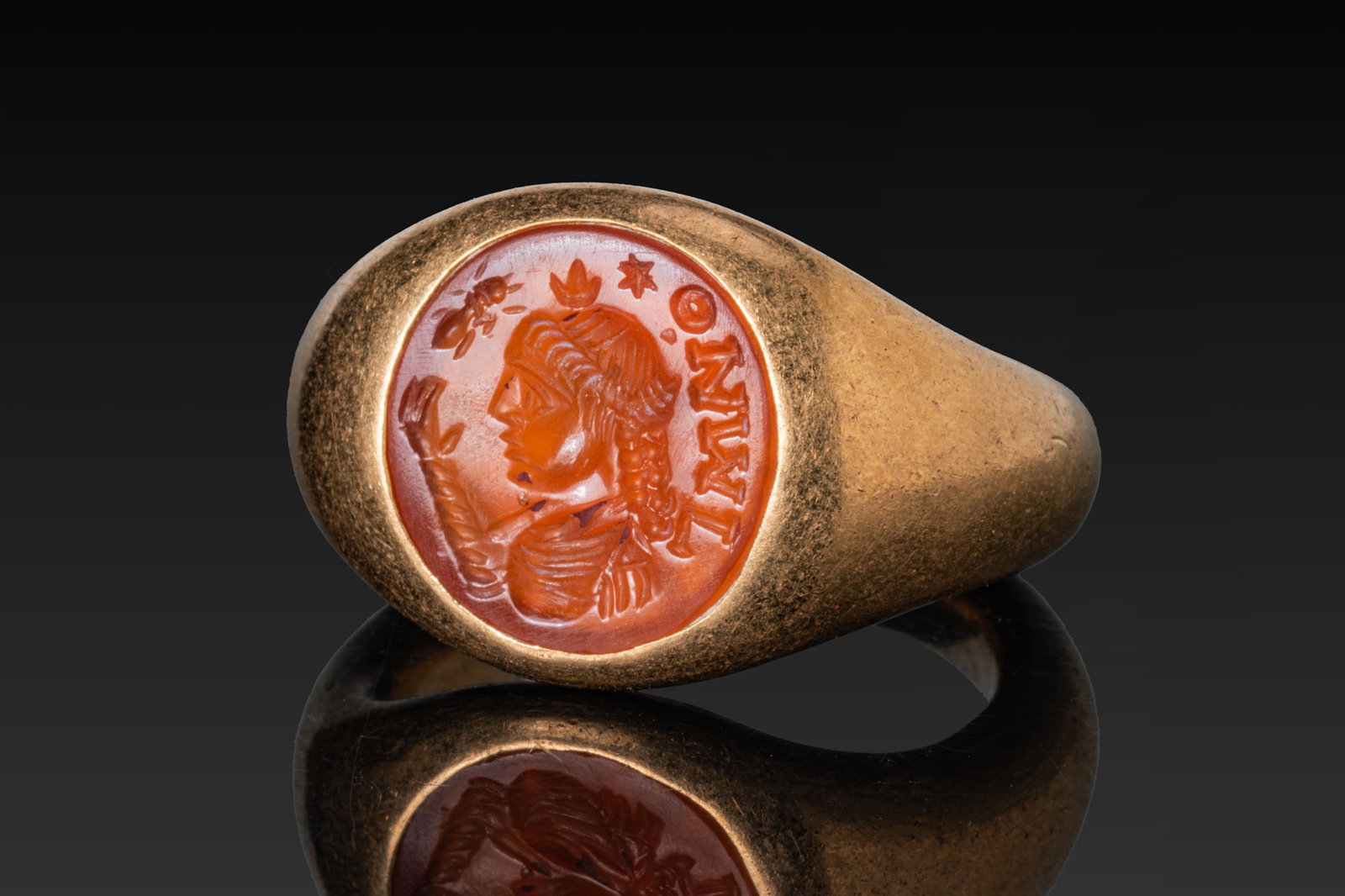 ROMAN CARNELIAN INTAGLIO WITH BUST OF ISIS AND ANT IN HIGH KARAT GOLD RING (1 of 3)