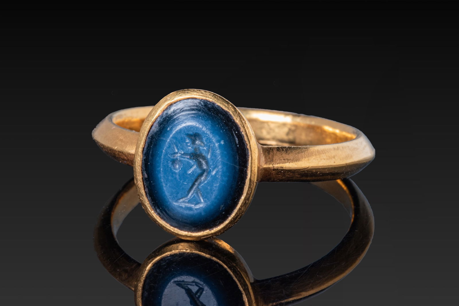 LATE ROMAN HIGH KARAT GOLD RING WITH NICOLO INTAGLIO OF MERCURY (1 of 3)