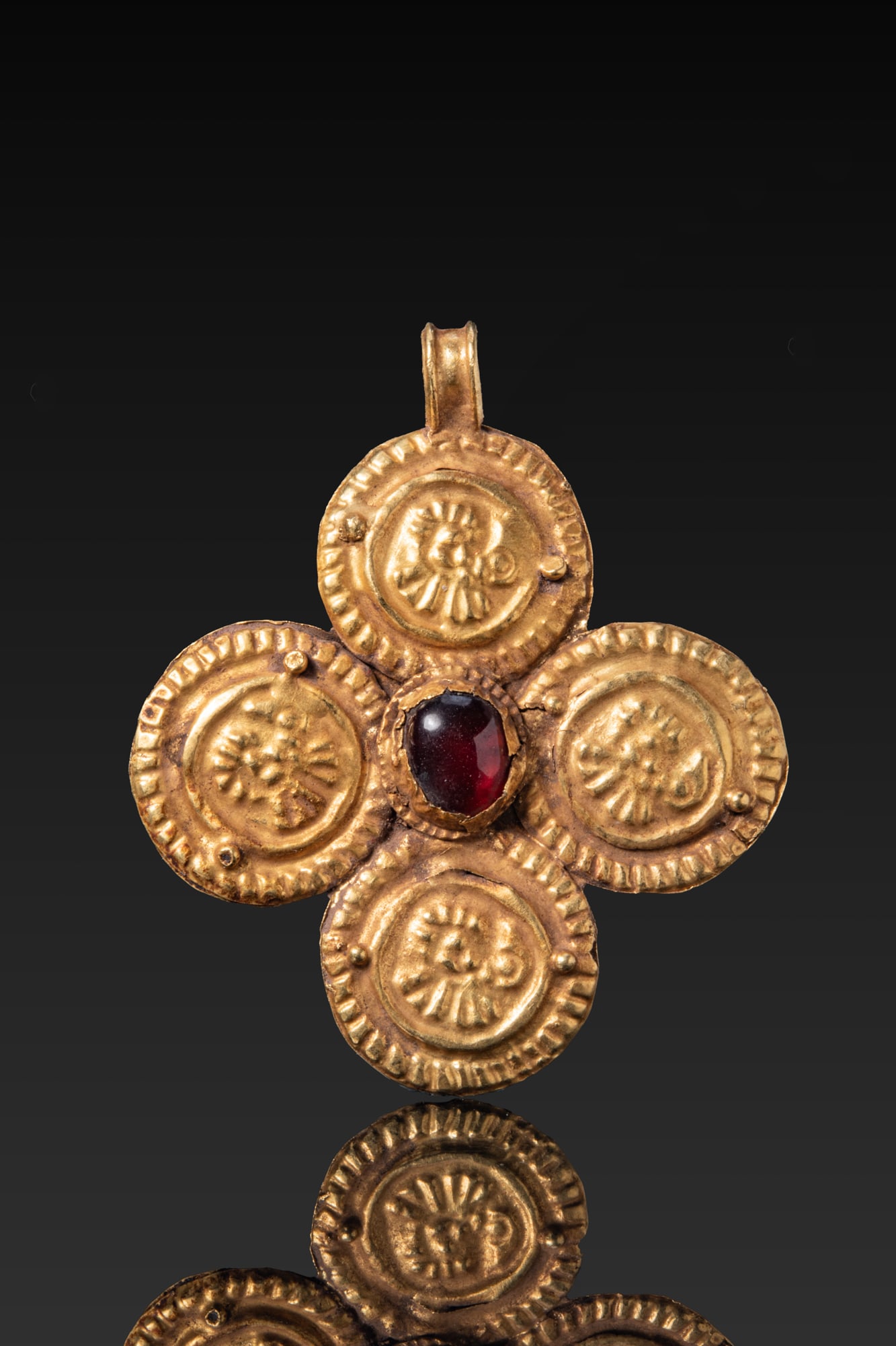 BYZANTINE HIGH KARAT GOLD CROSS WITH CENTRAL RED GARNET CABOCHON AND FOUR REPOUSS? MEDALLIONS (1 of 3)