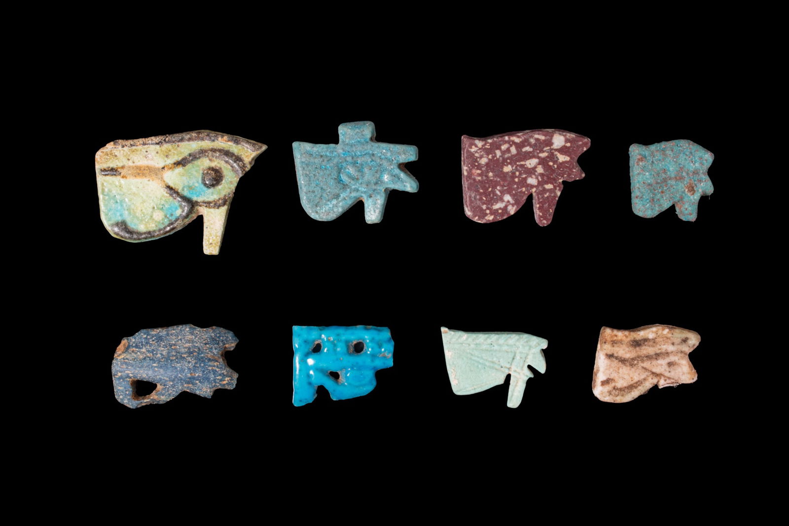 COLLECTION OF EGYPTIAN FAIENCE AND STONE WADJET AMULETS (1 of 2)