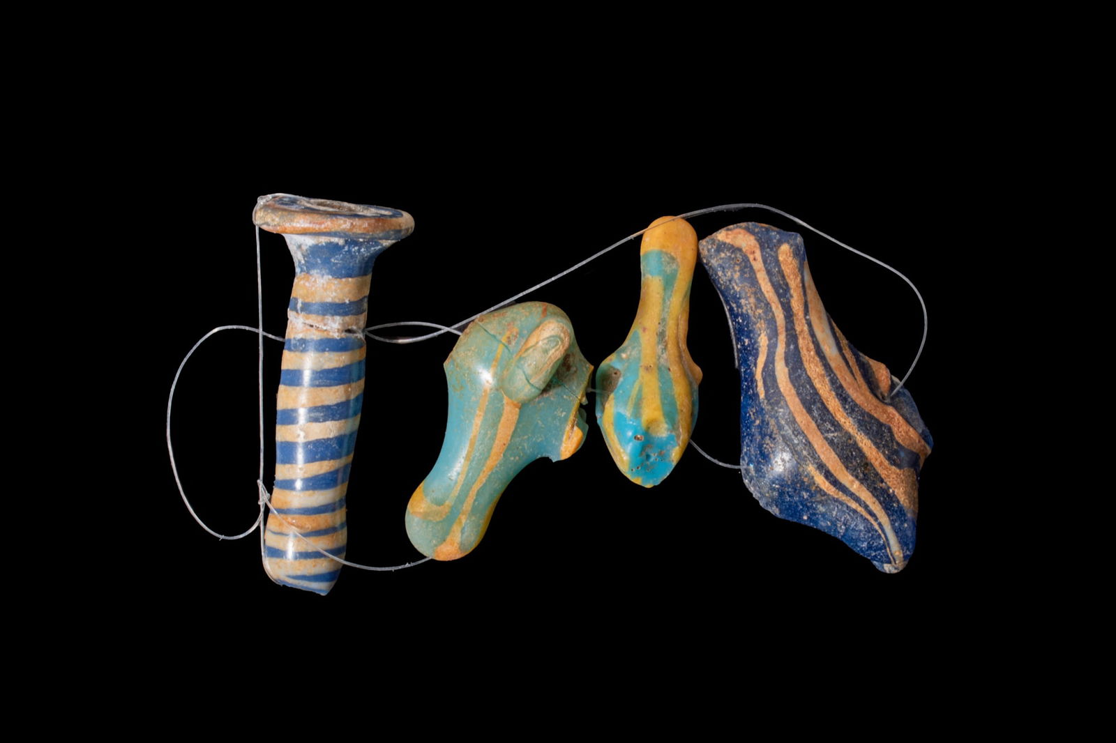 COLLECTION OF EGYPTIAN CORE-FORMED GLASS EAR PLUG AND AMULETS - EX CHRISTIE'S (1 of 2)