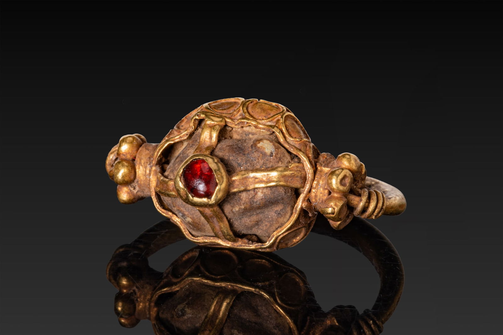 BYZANTINE OPENWORK HIGH KARAT GOLD DOMED RING WITH CENTRAL RED GARNET CABOCHON (1 of 3)