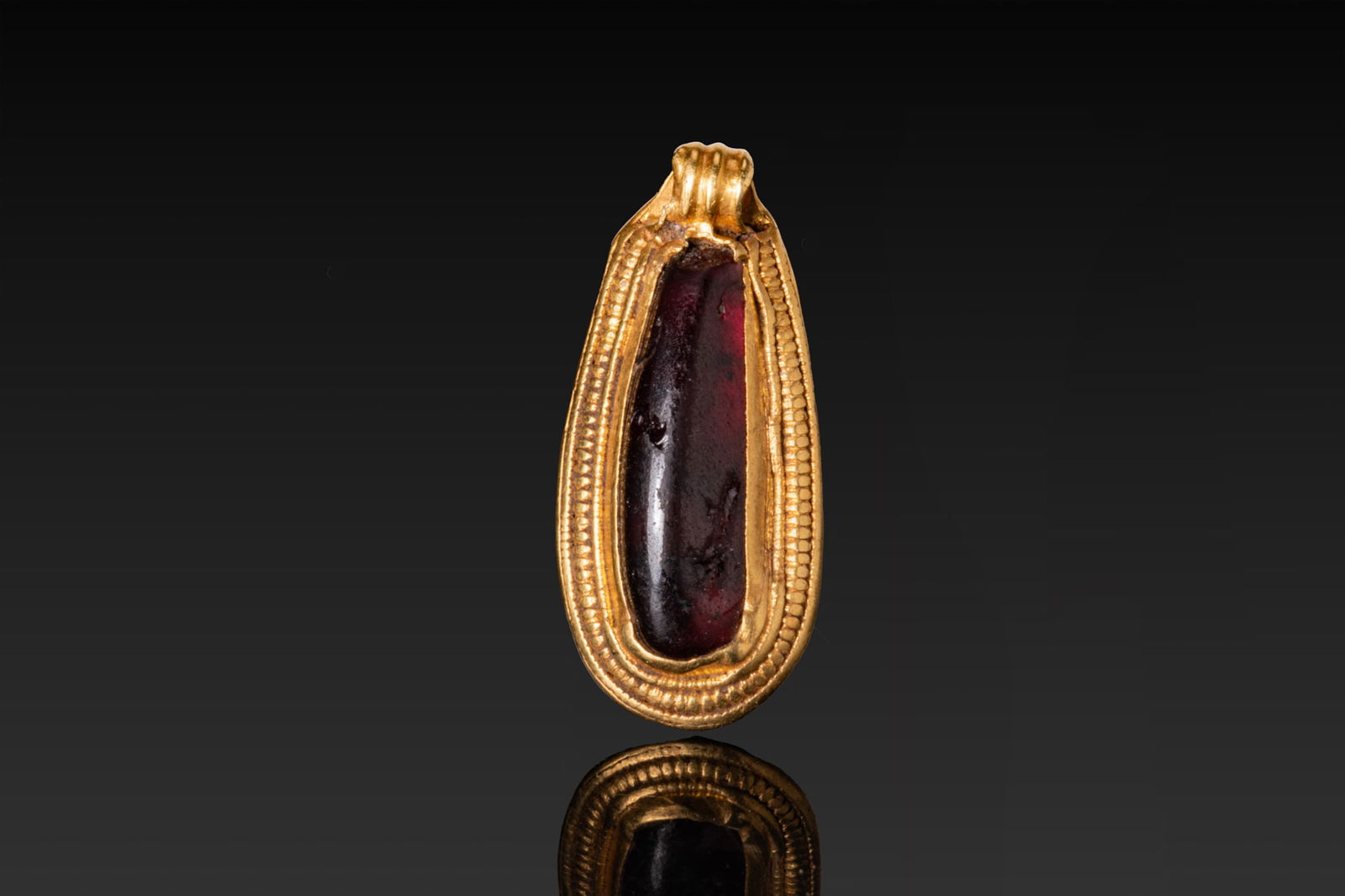 MEROVINGIAN HIGH KARAT GOLD PENDANT WITH RED GARNET CABOCHON (1 of 3)