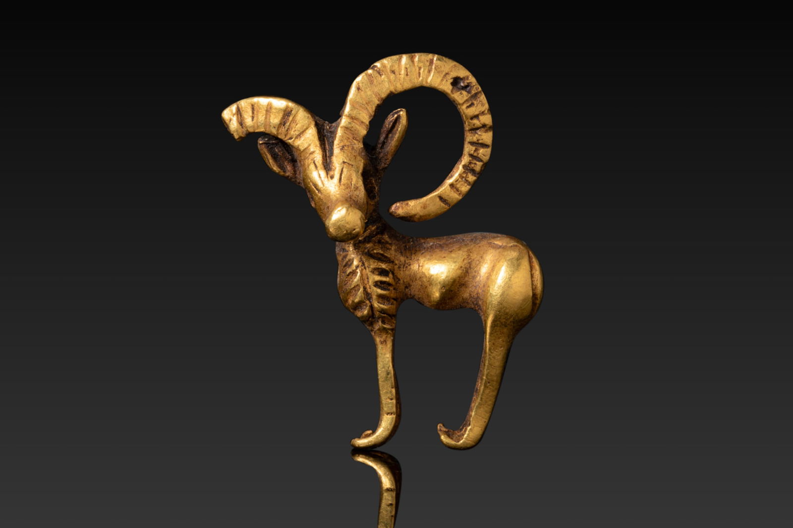 BACTRIAN HIGH KARAT GOLD FIGURINE OF AN IBEX (1 of 3)