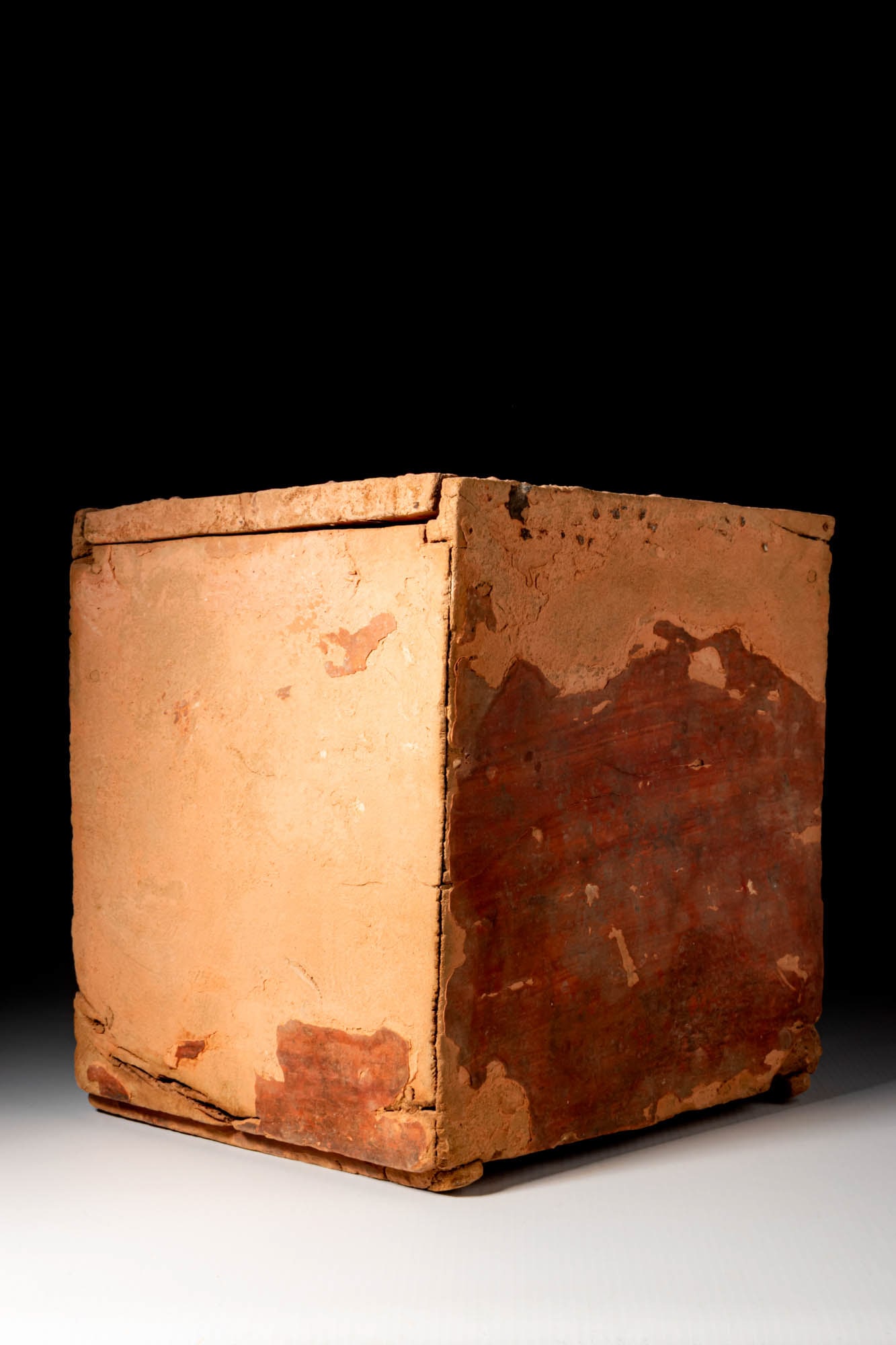 EGYPTIAN WOODEN BOX: Late Period, Ca. 664 - 332 BC. A rectangular box constructed from plain wooden panels with a smooth, flat surface and straight edges. The lid slides horizontally into place, guided by two raised side