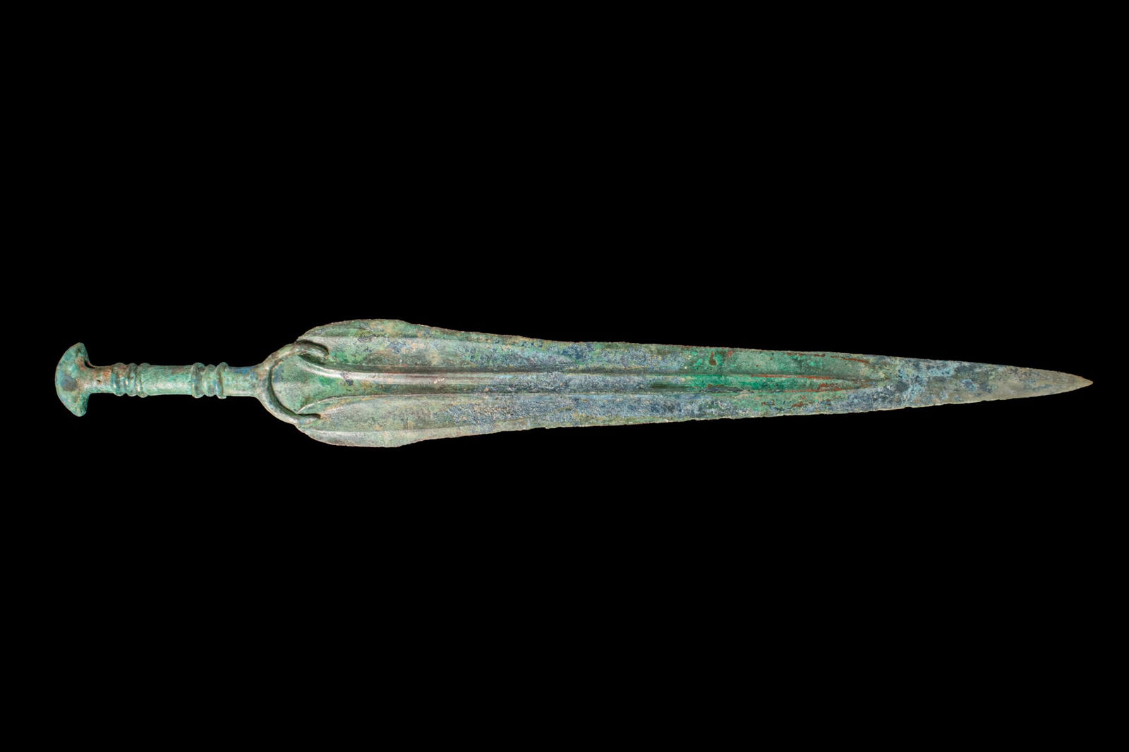 BRONZE AGE / EARLY GREEK PERIOD BRONZE DAGGER: Ca. 1100 - 800 BCA bronze dagger with a long, leaf-shaped blade tapering to a sharp point, both faces with a broad central fuller running from the rounded shoulders almost to the tip. The grip with